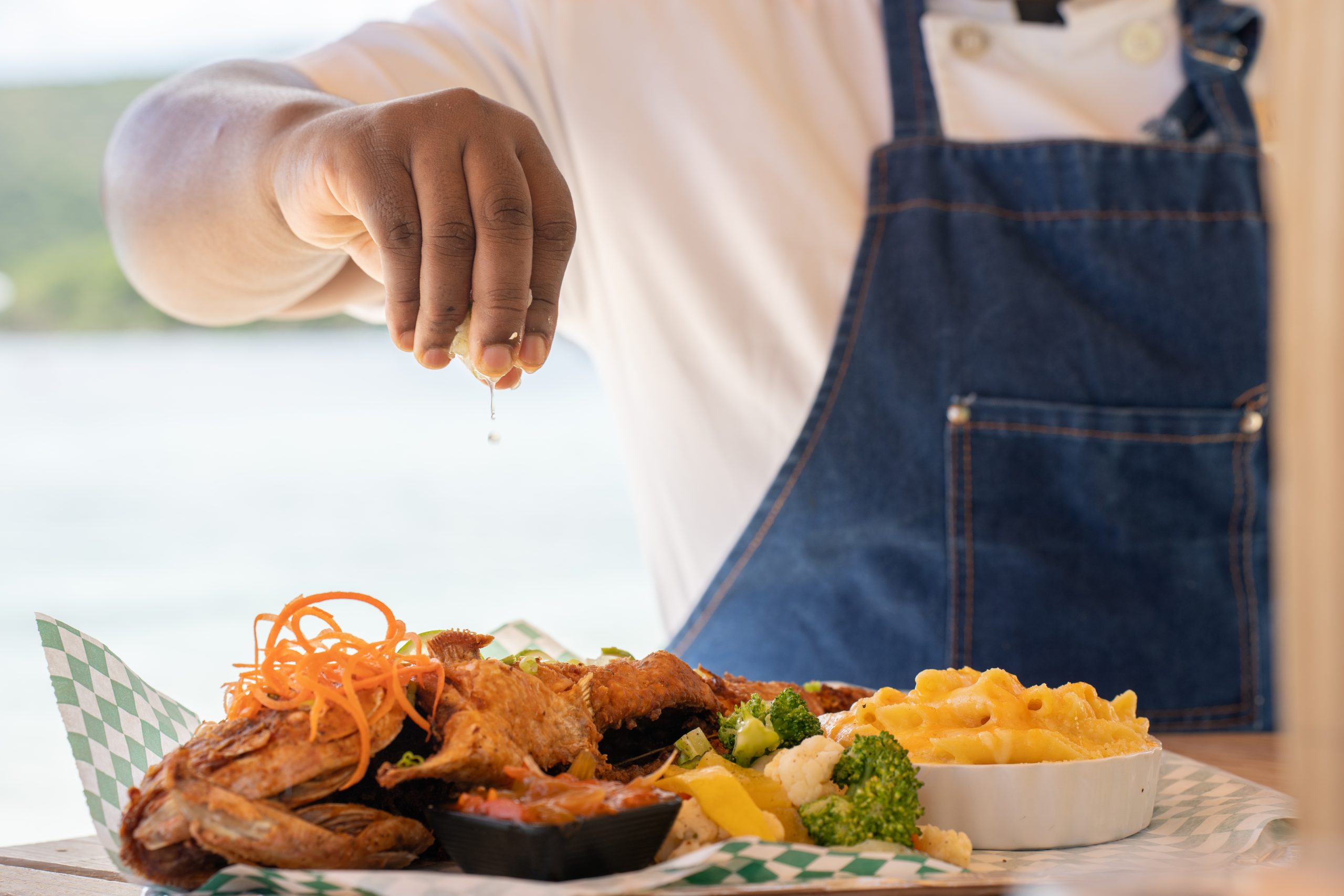 Marina Cay chef plating food for service